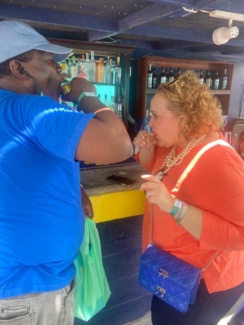 Nassau: Historic City Tour with Drink and Food Tasting - Arawak Cay fish fry: conch fritters and the smell test at the water