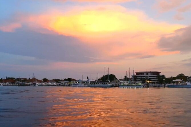 Nassau Sunset Dinner Cruise - Sunset hour: Atlantis Harbor views from a boat that moves
