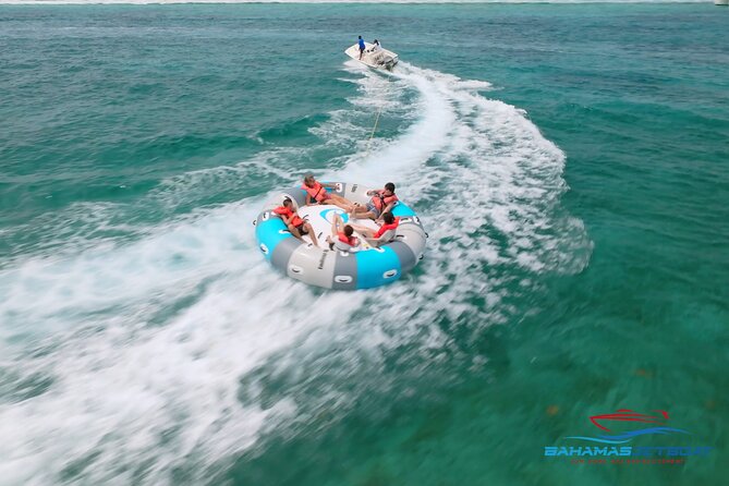 The Ultimate Bahamian Beach Day: Pigs, Jet Ski, Snorkeling & More - The private beach club side, swings, hammocks, and games with your crew
